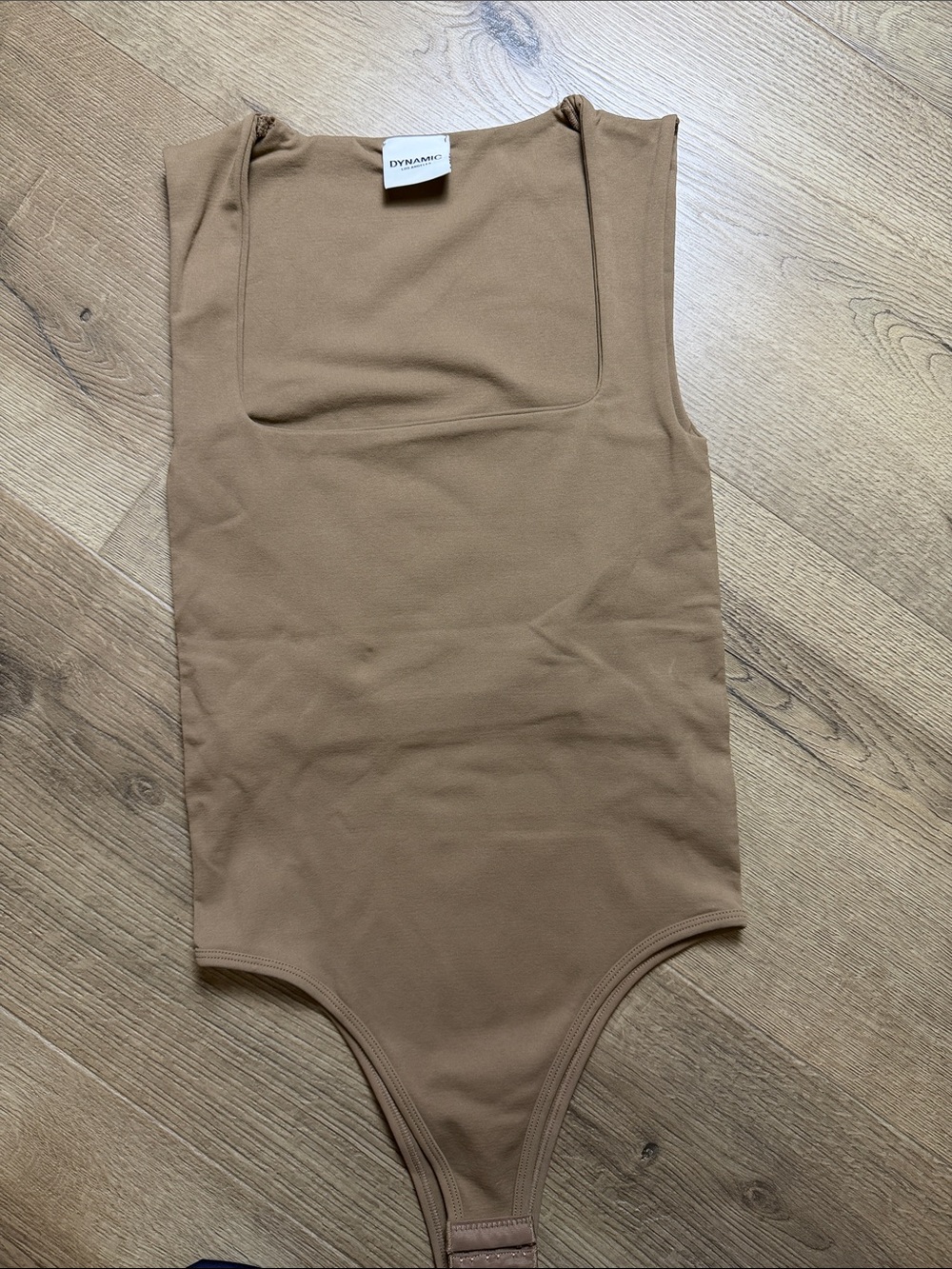 Dynamic Square-Neck Tan smooth Bodysuit. Never worn. One size fits most